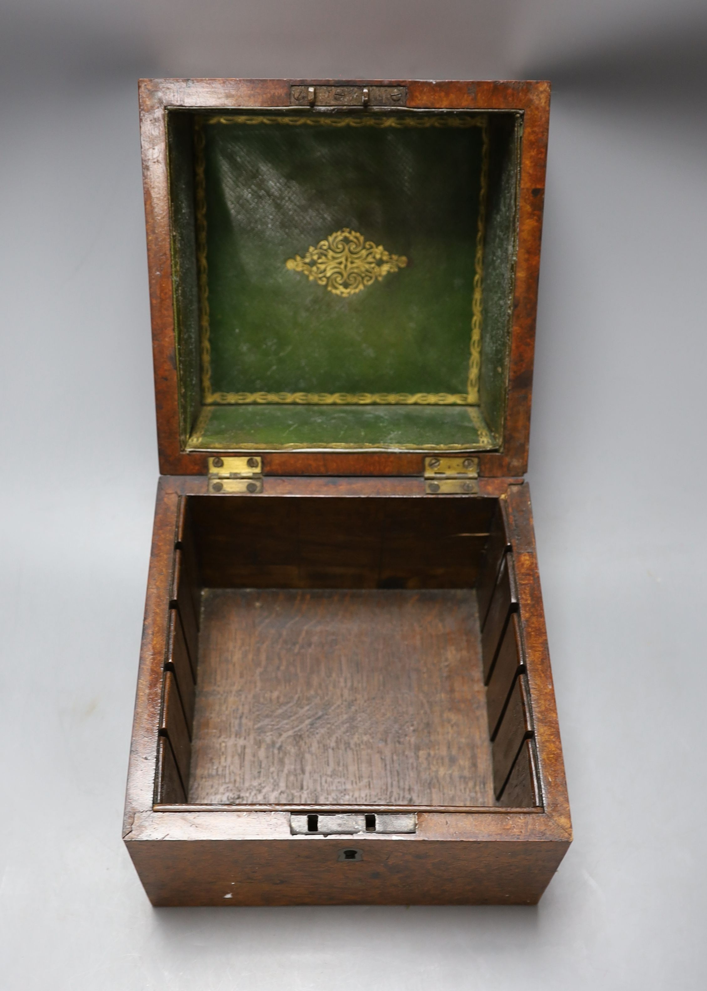 A 19th century amboyna box, 22cm wide, a Sestrel ship's wall clock, no key - 20cm diameter, a large plated two-handled tray - 71cm long, Vintage Ogden Smith fishing reel together with another (5)